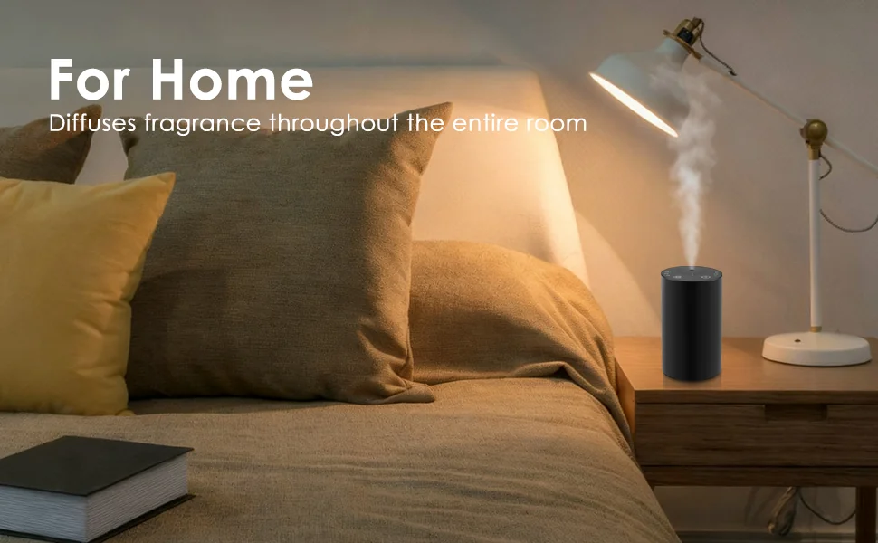 Black portable waterless essential oil diffuser scenting a bedroom nightstand